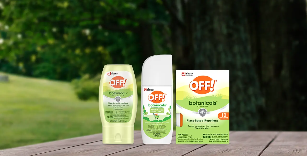 Collection of OFF! Botanicals products sitting on a a table with trees in the background
